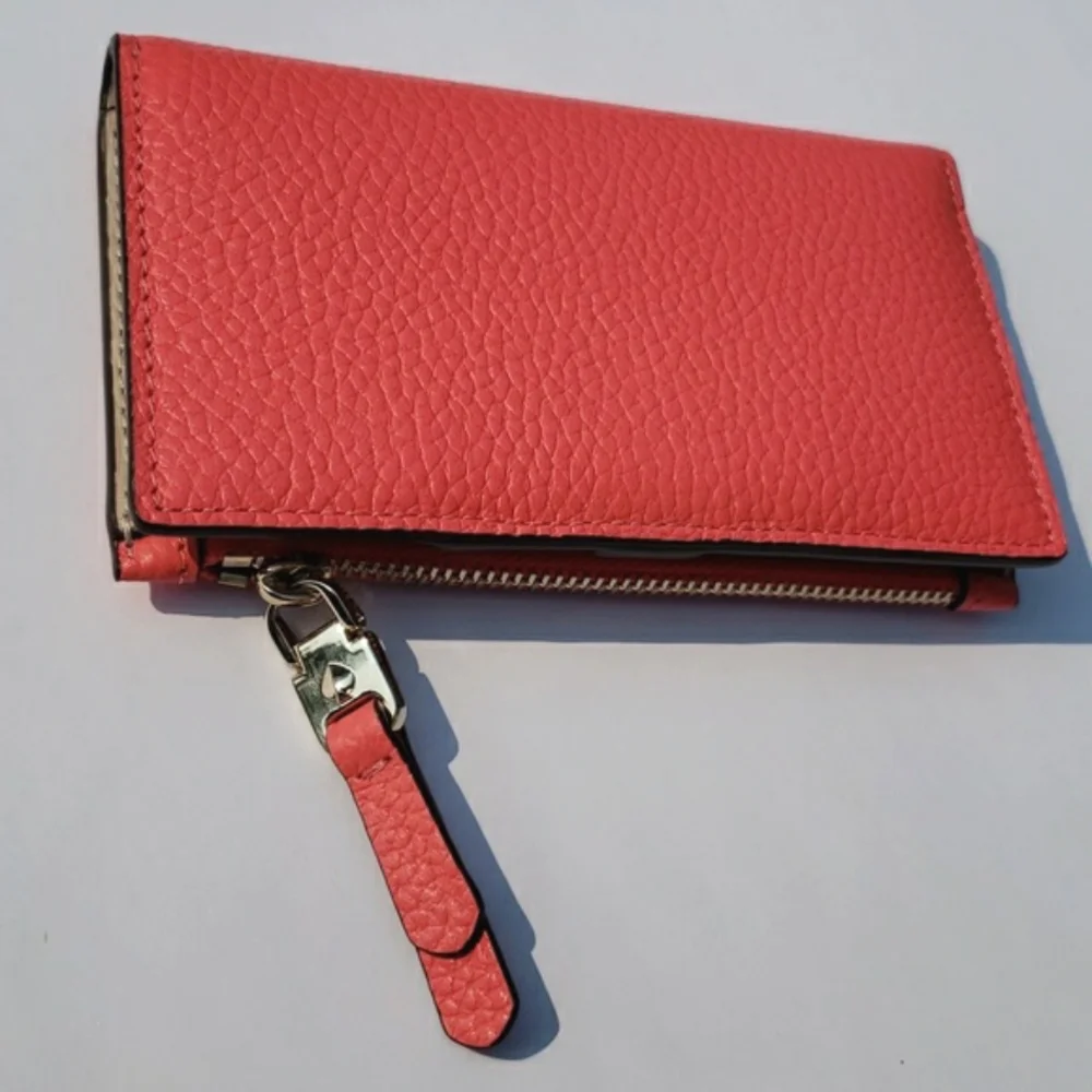 Kate Spade Leather Roulette Small Slim Bifold Wallet. Color: Peachmelba.